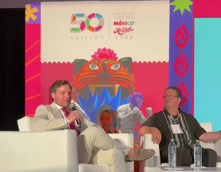 Max Murciano speaking on stage at the 50th Tianguis Turístico México in Acapulco, 2026